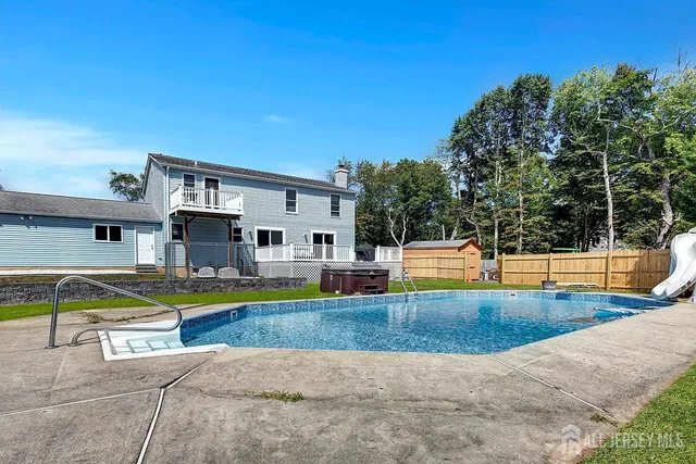 a view of a swimming pool with lounge chairs