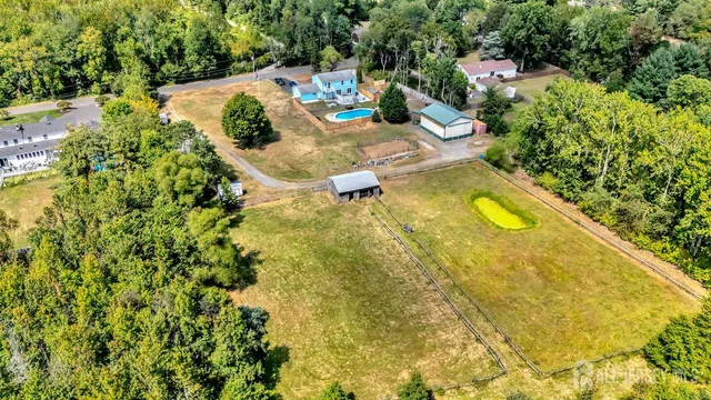 a view of a swimming pool in the backyard of water fountain