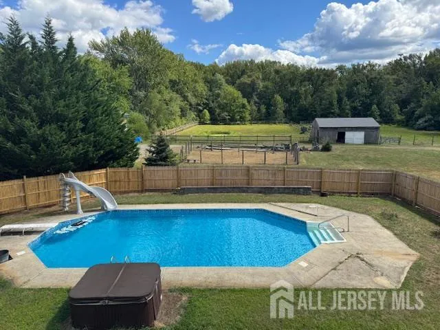 a view of a swimming pool with a lounge chairs