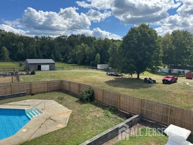 a view of a swimming pool with a lounge chairs
