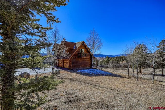 a view of a porch with wooden floor