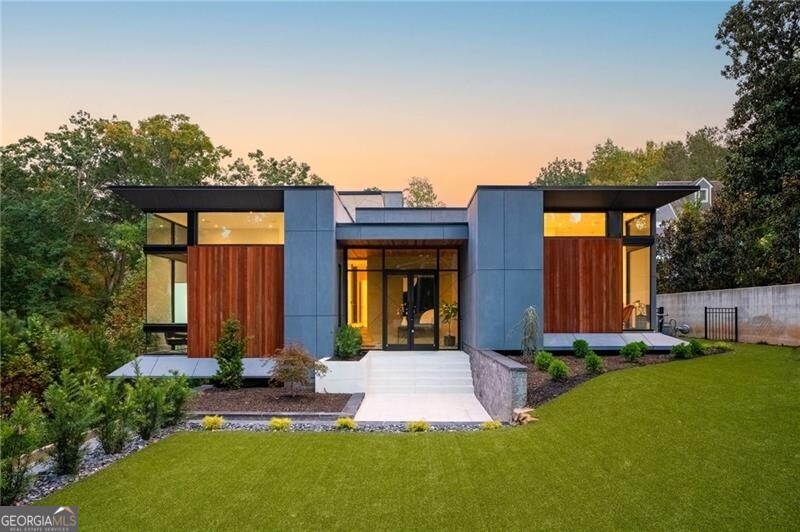 4099 Randall Mill Road Northwest Atlanta, GA 30327 - Photo 1 of 1 a front view of a house with a yard