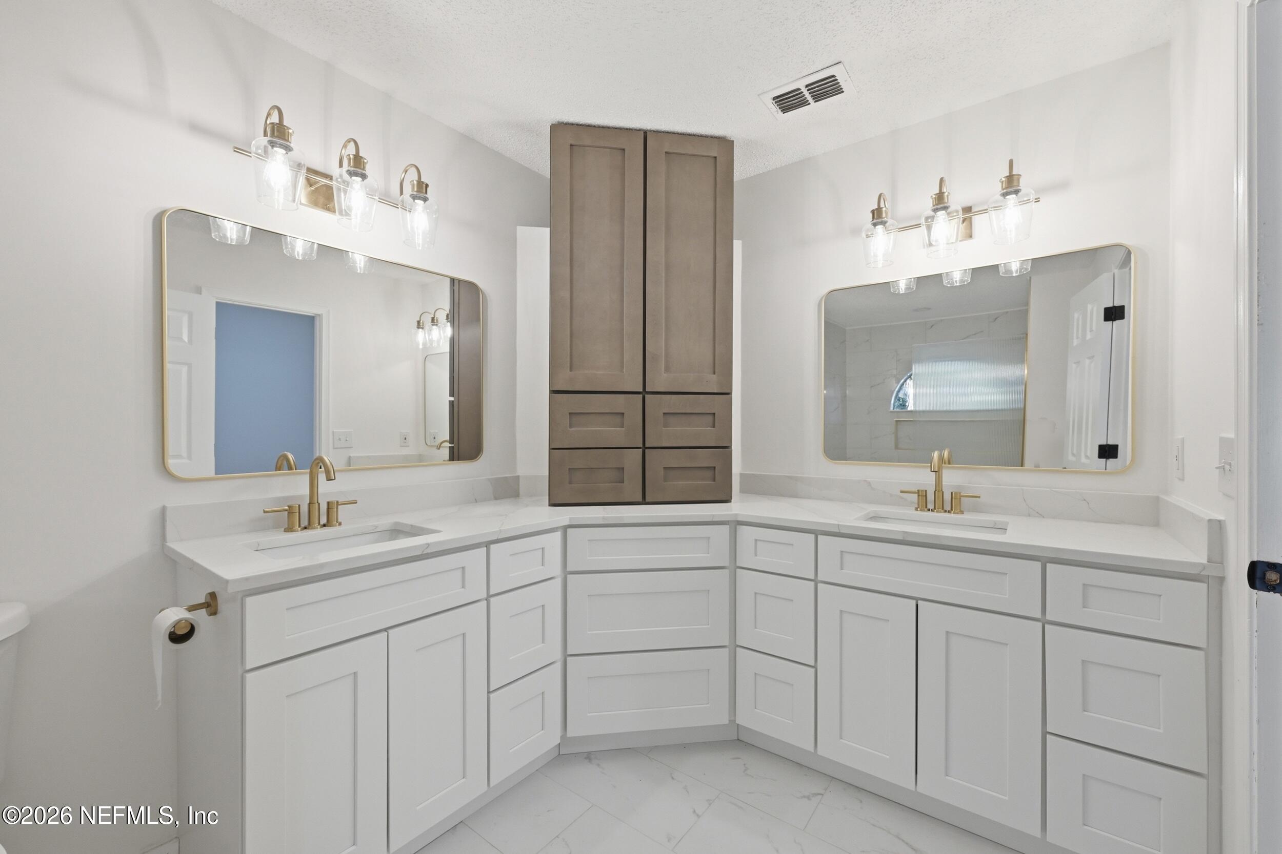 3286 Marbon Road Jacksonville, FL 32223 - Photo 25 of 36 a bathroom with a sink vanity and mirror
