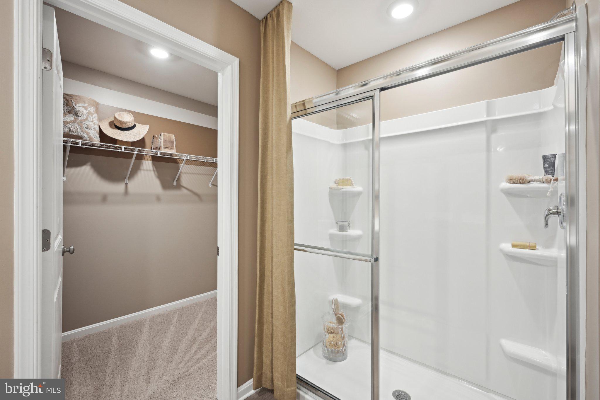 1158 Wintermead Loop Salisbury, MD 21801 - Photo 26 of 40 a bathroom with a glass shower door and a mirror