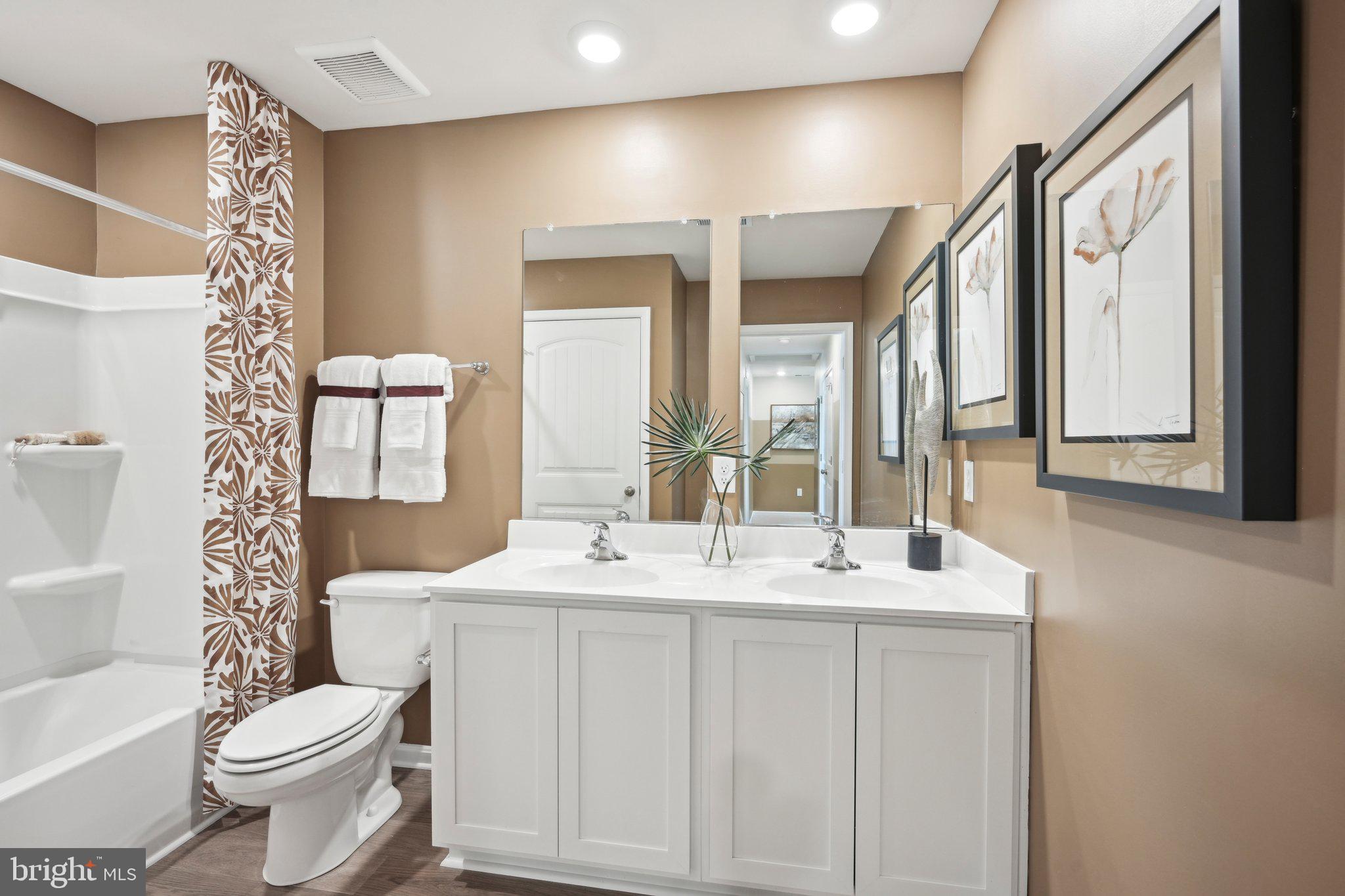 1158 Wintermead Loop Salisbury, MD 21801 - Photo 37 of 40 a bathroom with a sink toilet and mirror