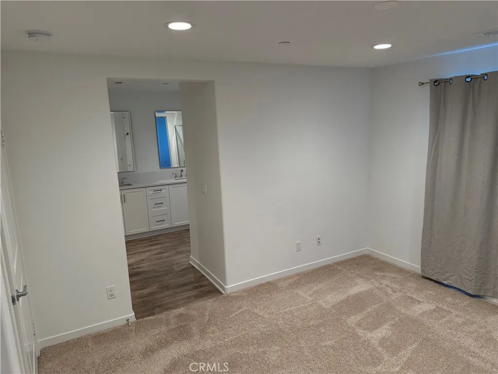9504 North Corterra Panorama City, CA 91402 - Photo 12 of 24 an empty room with closet and mirror
