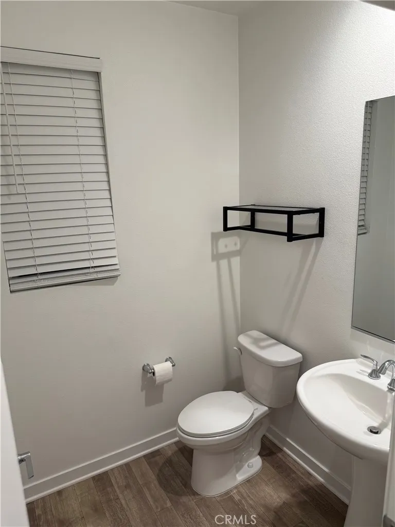 9504 North Corterra Panorama City, CA 91402 - Photo 21 of 24 a white toilet sitting next to a bathroom sink
