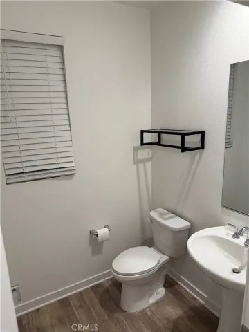 a bathroom with double sink and a mirror