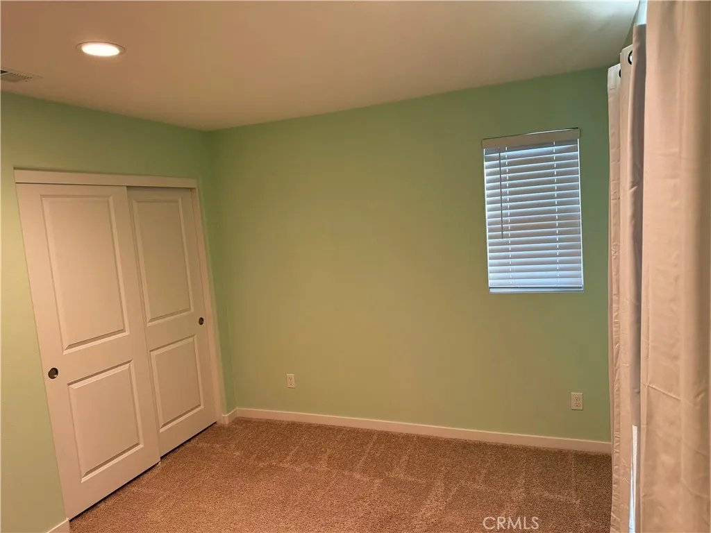 9504 North Corterra Panorama City, CA 91402 - Photo 7 of 24 a view of an empty room with closet and a window