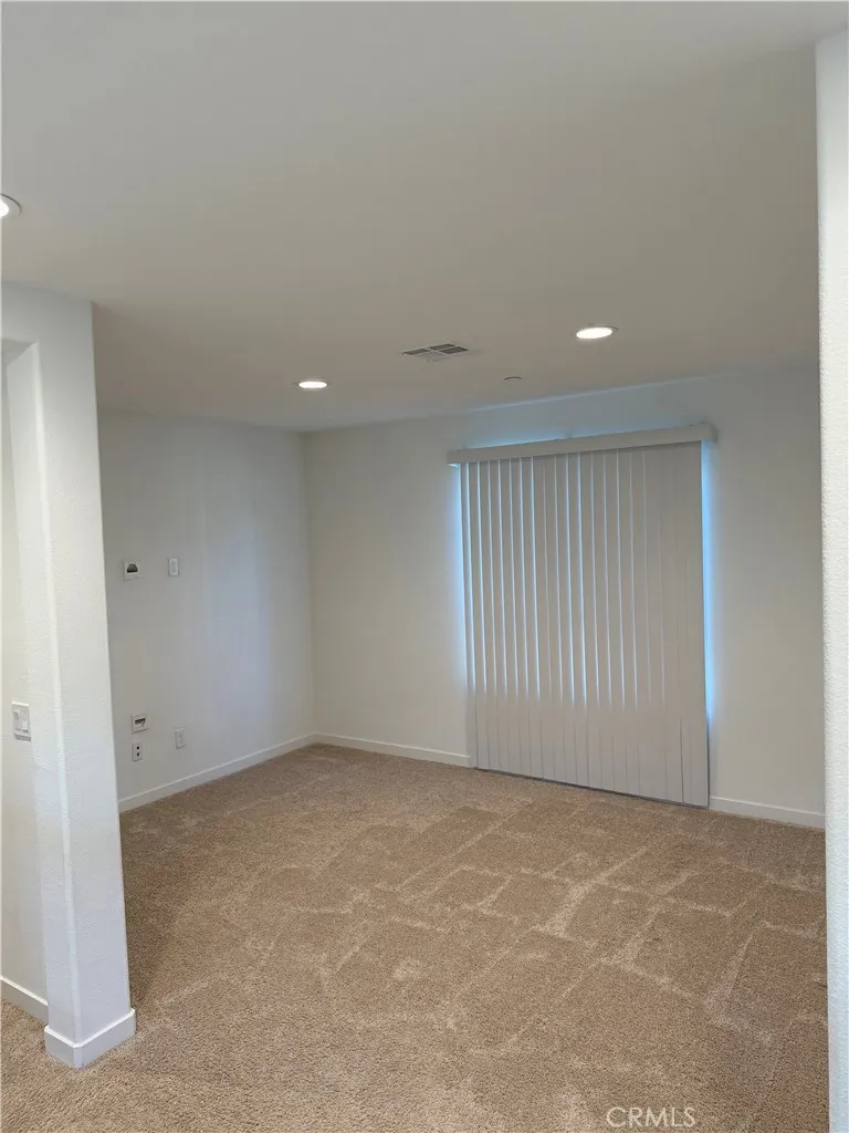 9504 North Corterra Panorama City, CA 91402 - Photo 10 of 24 an empty room with a empty space and windows