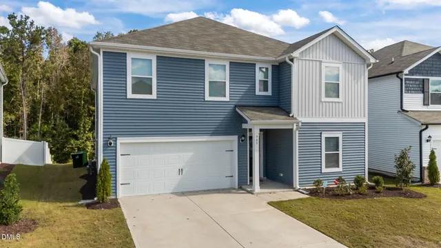 a front view of a house with garage