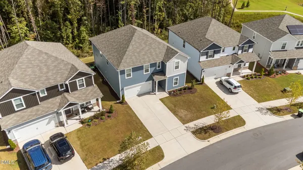 an aerial view of a house with swimming pool