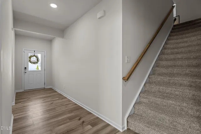 wooden floor in an empty room with a gallery