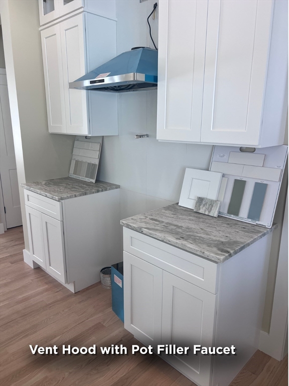 337 Chicopee Street, Unit LOT 8 Granby, MA 01033 - Photo 15 of 21 a kitchen with a stove and cabinets