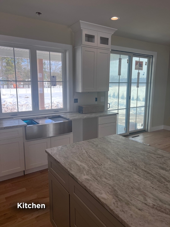 337 Chicopee Street, Unit LOT 8 Granby, MA 01033 - Photo 16 of 21 a large kitchen with granite countertop a sink and a stove