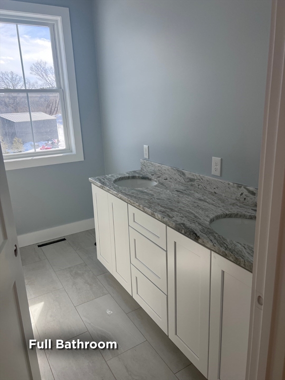 337 Chicopee Street, Unit LOT 8 Granby, MA 01033 - Photo 9 of 21 a bathroom with a granite countertop sink and a vanity