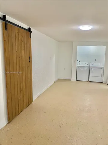 an empty room with a empty space and a window