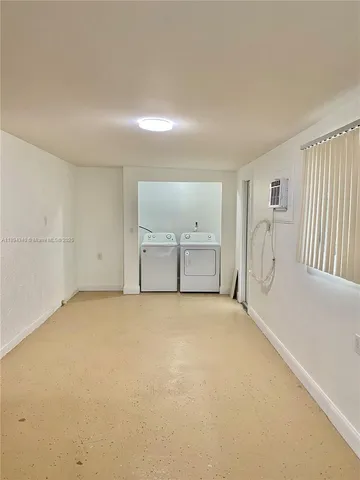 a view of a room with cabinet and windows