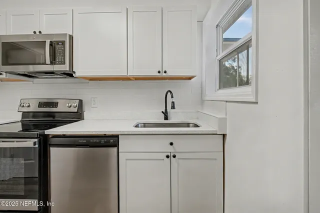 a view of balcony with wooden floor and fence