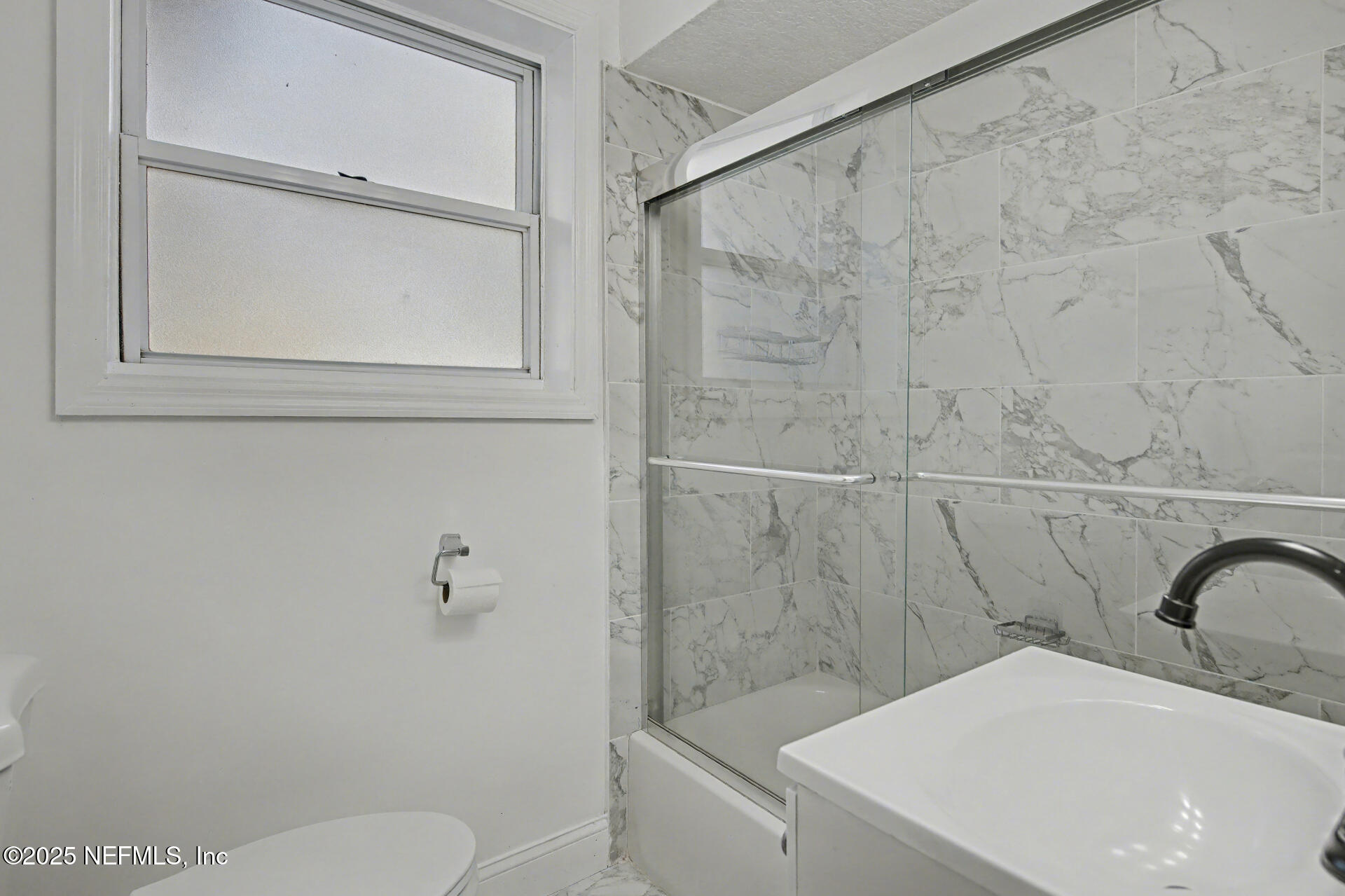 1503 Broome Street Fernandina Beach, FL 32034 - Photo 23 of 38 a bathroom with a sink a toilet and a shower