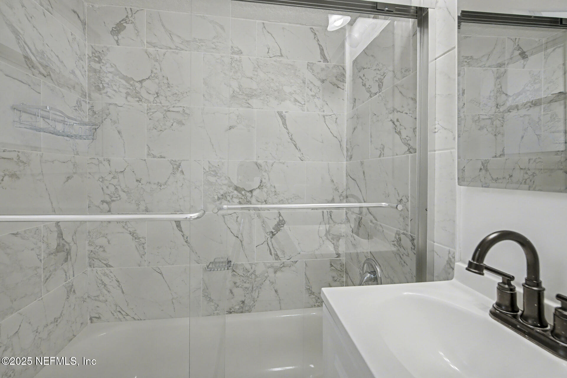 1503 Broome Street Fernandina Beach, FL 32034 - Photo 24 of 38 a bathroom with a sink a mirror and vanity