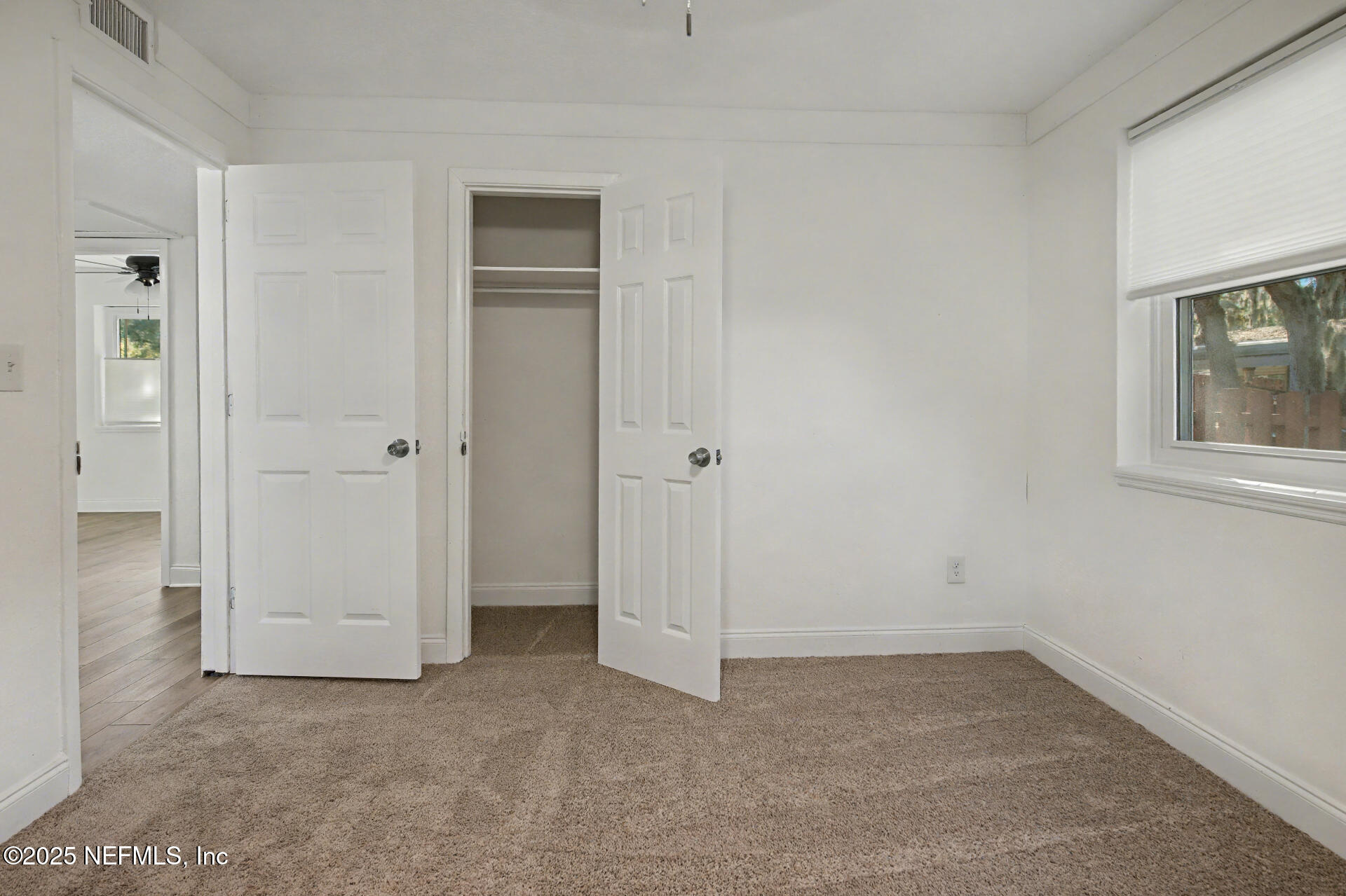 1503 Broome Street Fernandina Beach, FL 32034 - Photo 26 of 38 an empty room with windows and closet