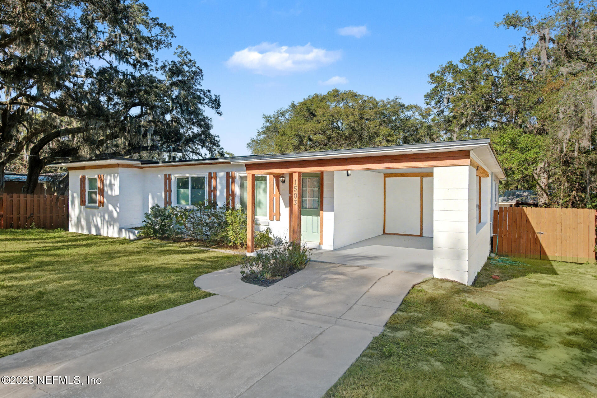 1503 Broome Street Fernandina Beach, FL 32034 - Photo 3 of 38 a view of a house with backyard and garden