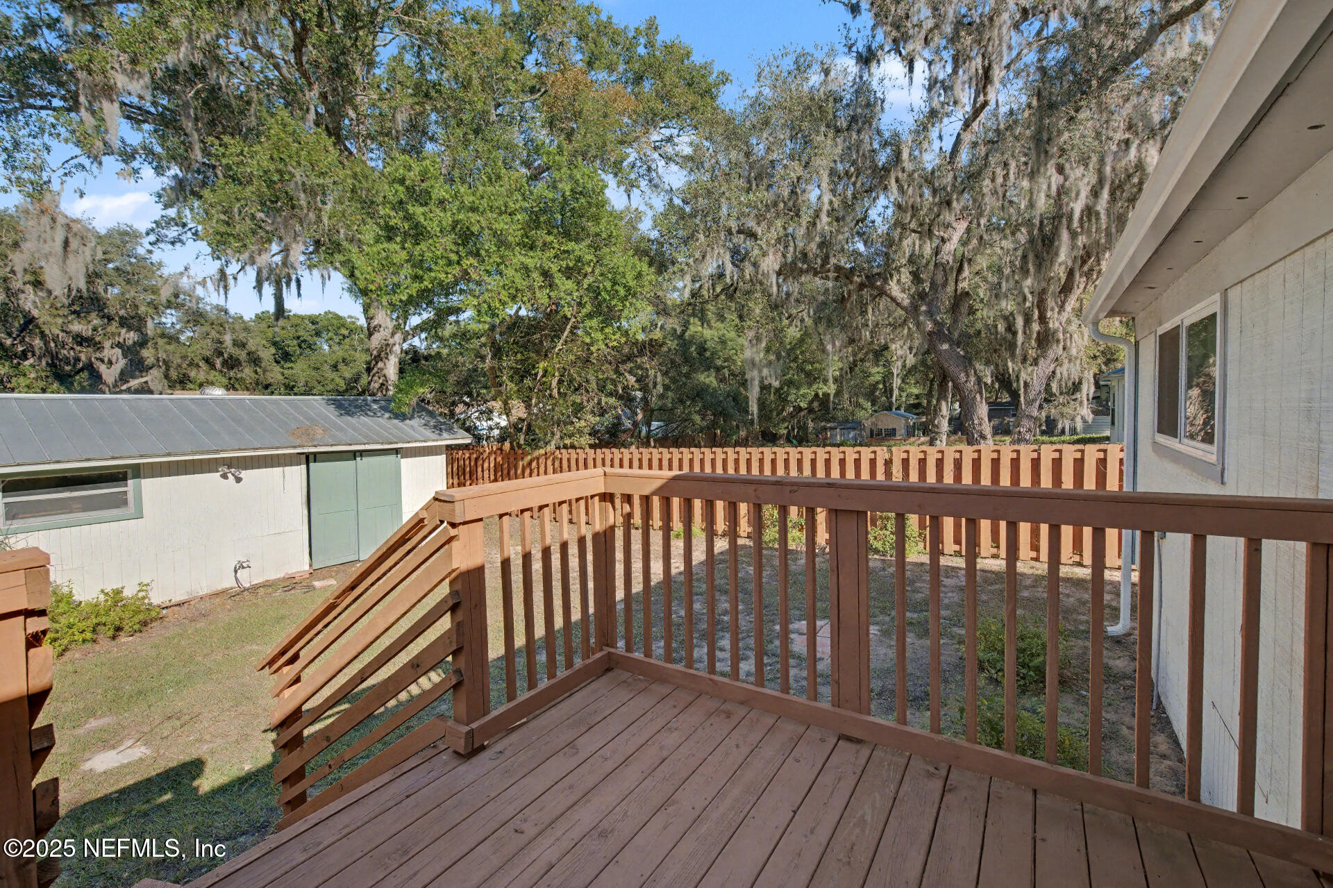 1503 Broome Street Fernandina Beach, FL 32034 - Photo 36 of 38 a view of balcony with wooden floor and fence