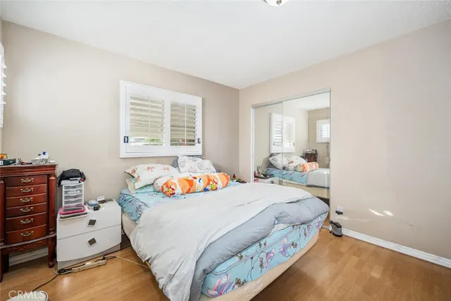 a bedroom with a bed and with furniture