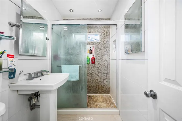 a bathroom with a sink and mirror