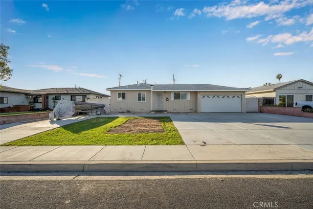 a view of house with yard and mountain view