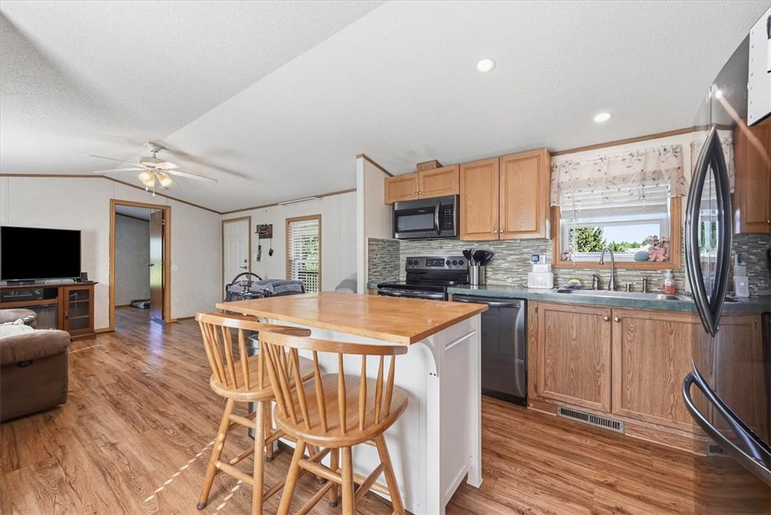 6129 Memorial Road Allentown, PA 18104 - Photo 19 of 46 Warm wood floors connect the casual dining island to the bright kitchen workspaces.