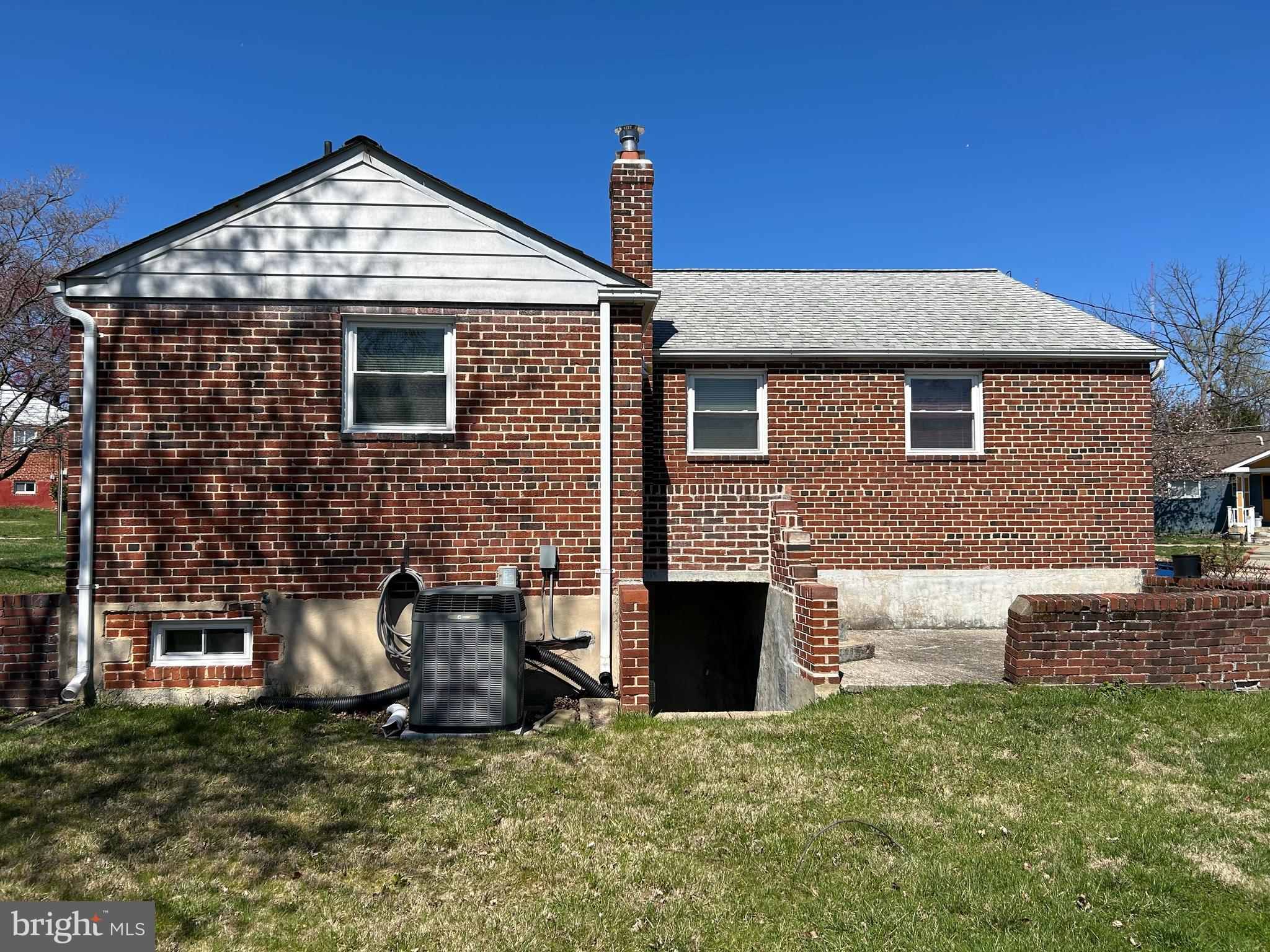 11015 Burnley Terrace Silver Spring, MD 20902 - Photo 3 of 4 a front view of a house with a yard