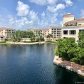 a front view of a house with a lake view