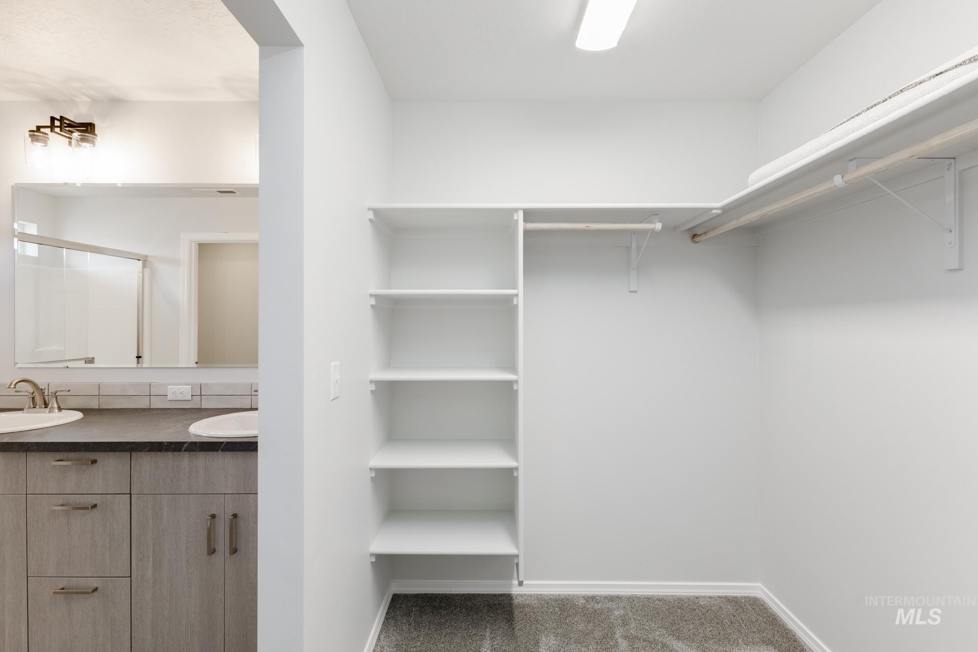1611 Sunday River Street Middleton, ID 83644 - Photo 15 of 17 Walk in closet featuring dark colored carpet and a sink