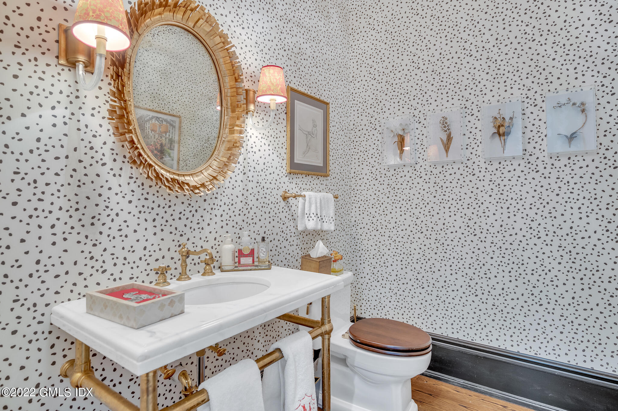 21 Woodside Drive Greenwich, CT 06830 - Photo 11 of 35 a bathroom with a sink a toilet and a mirror