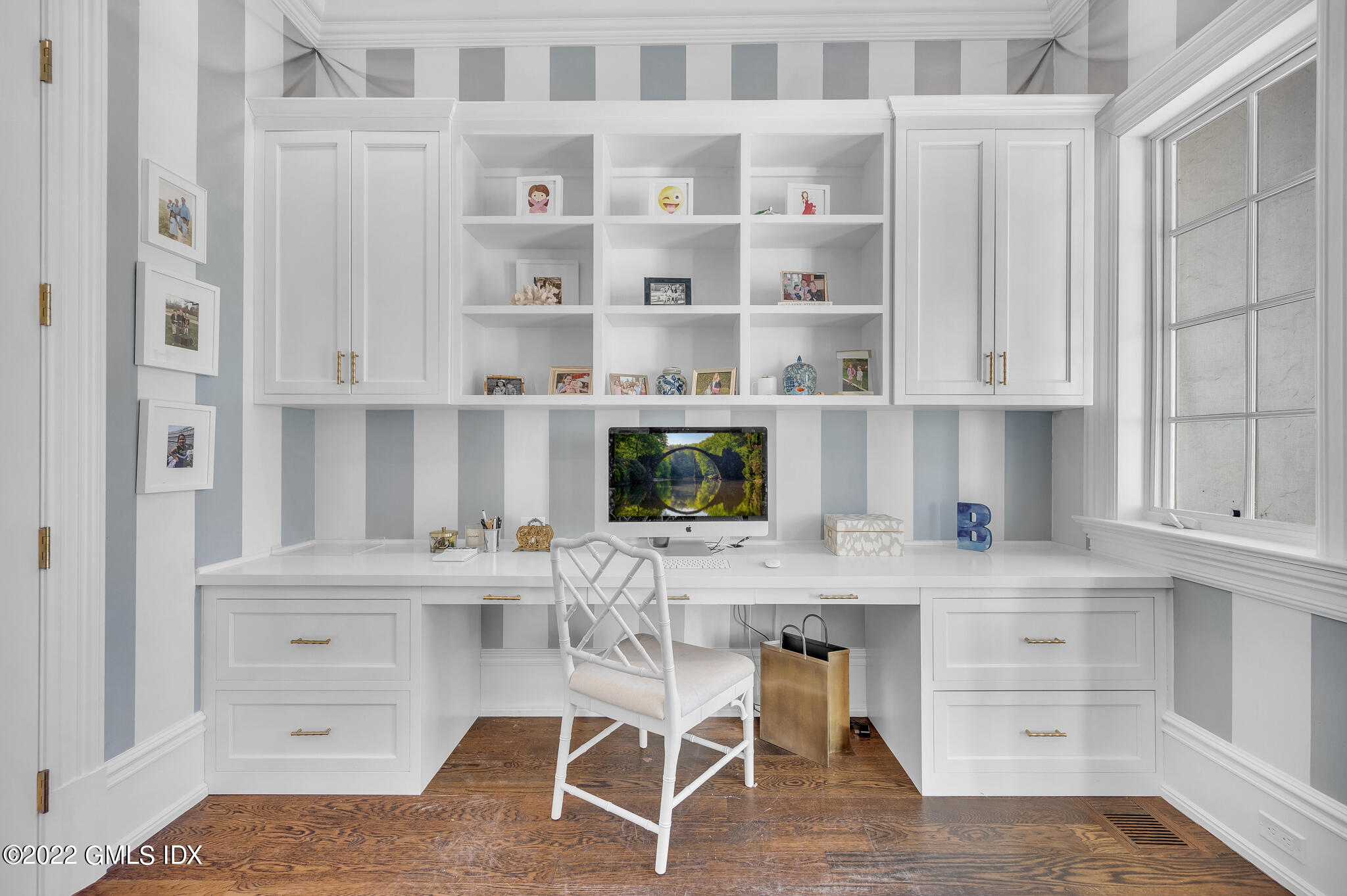 21 Woodside Drive Greenwich, CT 06830 - Photo 12 of 35 a kitchen with white cabinets and chair