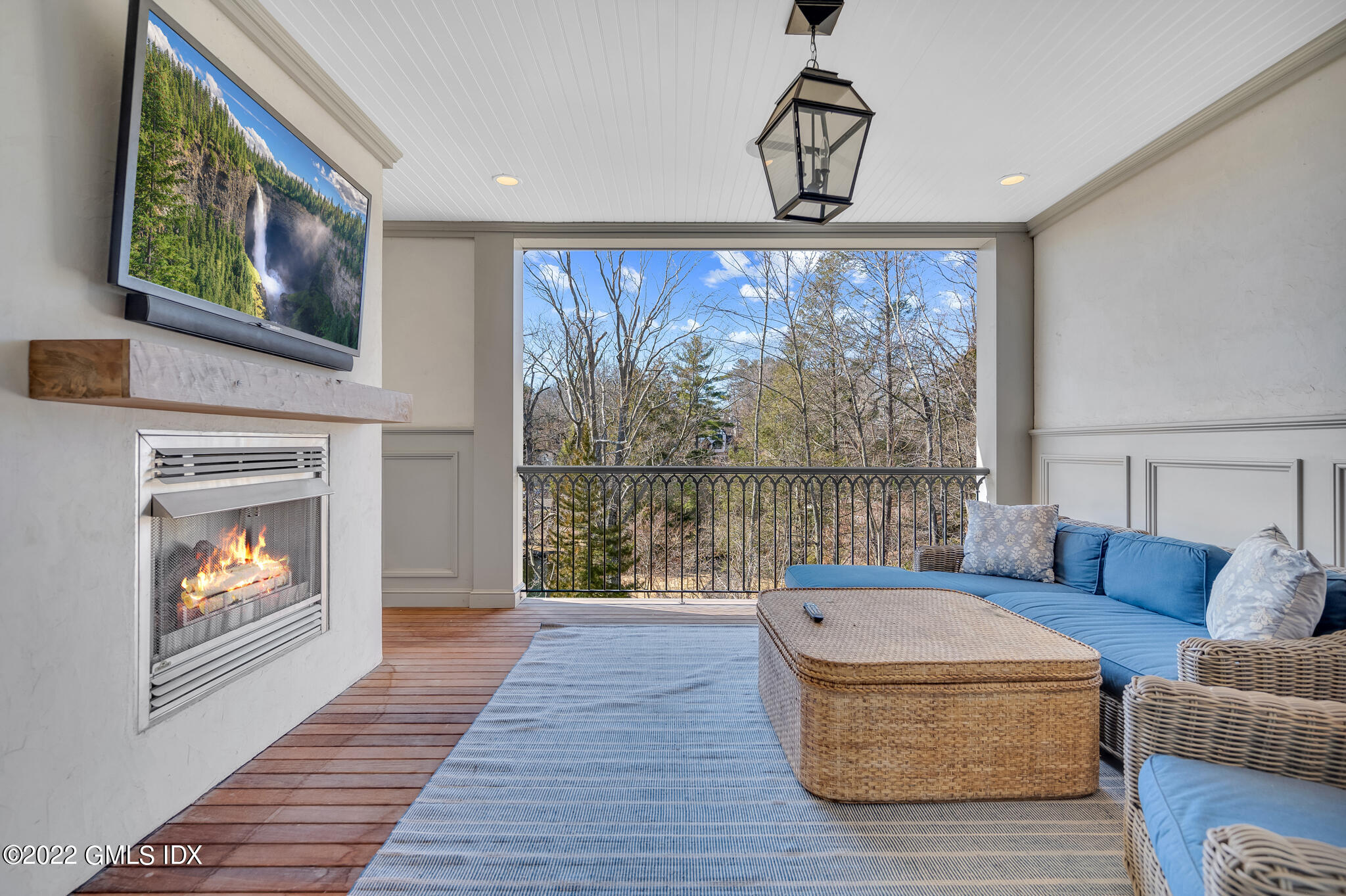 21 Woodside Drive Greenwich, CT 06830 - Photo 13 of 35 a living room with furniture a fireplace and a flat screen tv