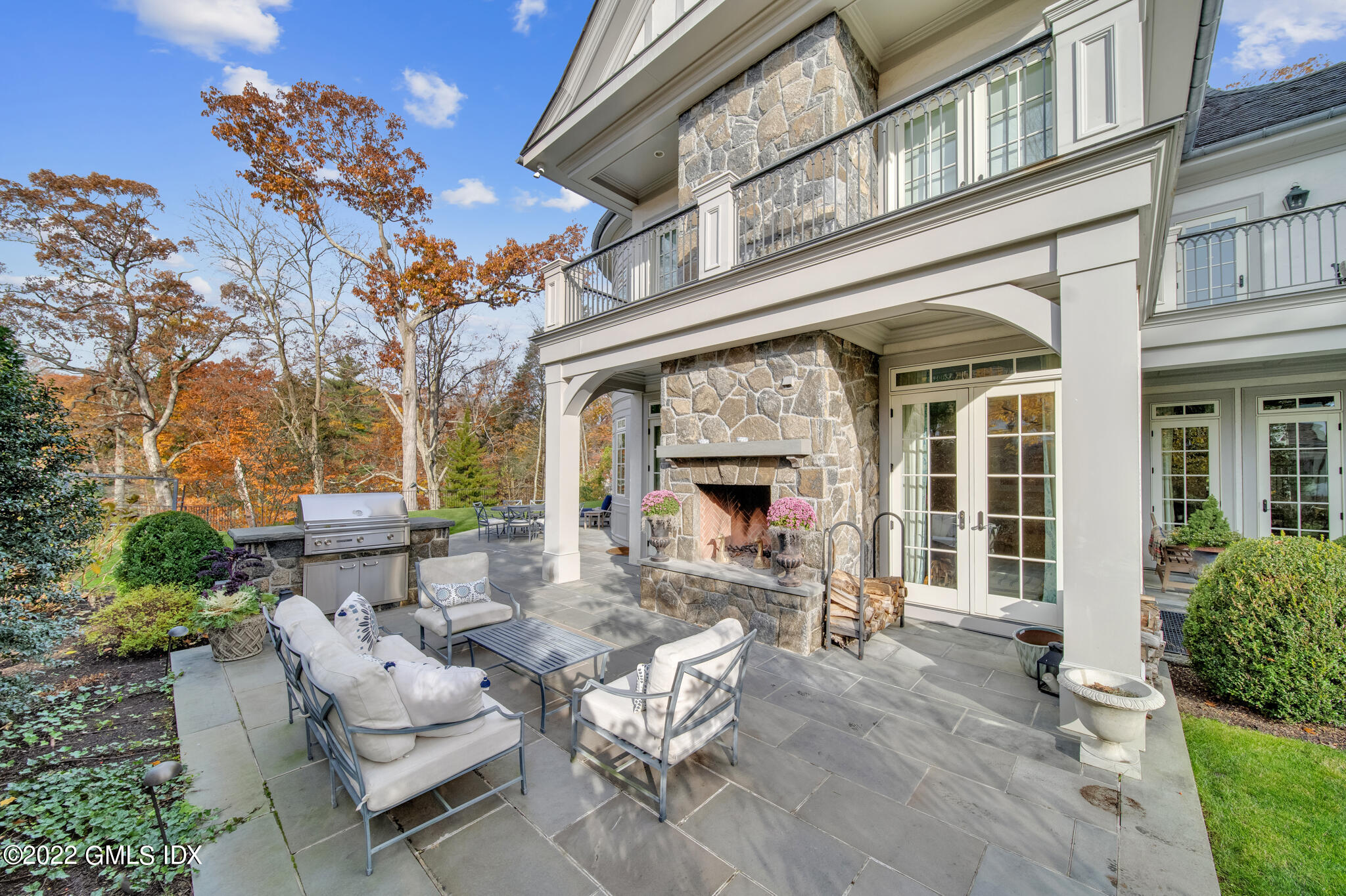 21 Woodside Drive Greenwich, CT 06830 - Photo 26 of 35 a building outdoor space with patio furniture and potted plants