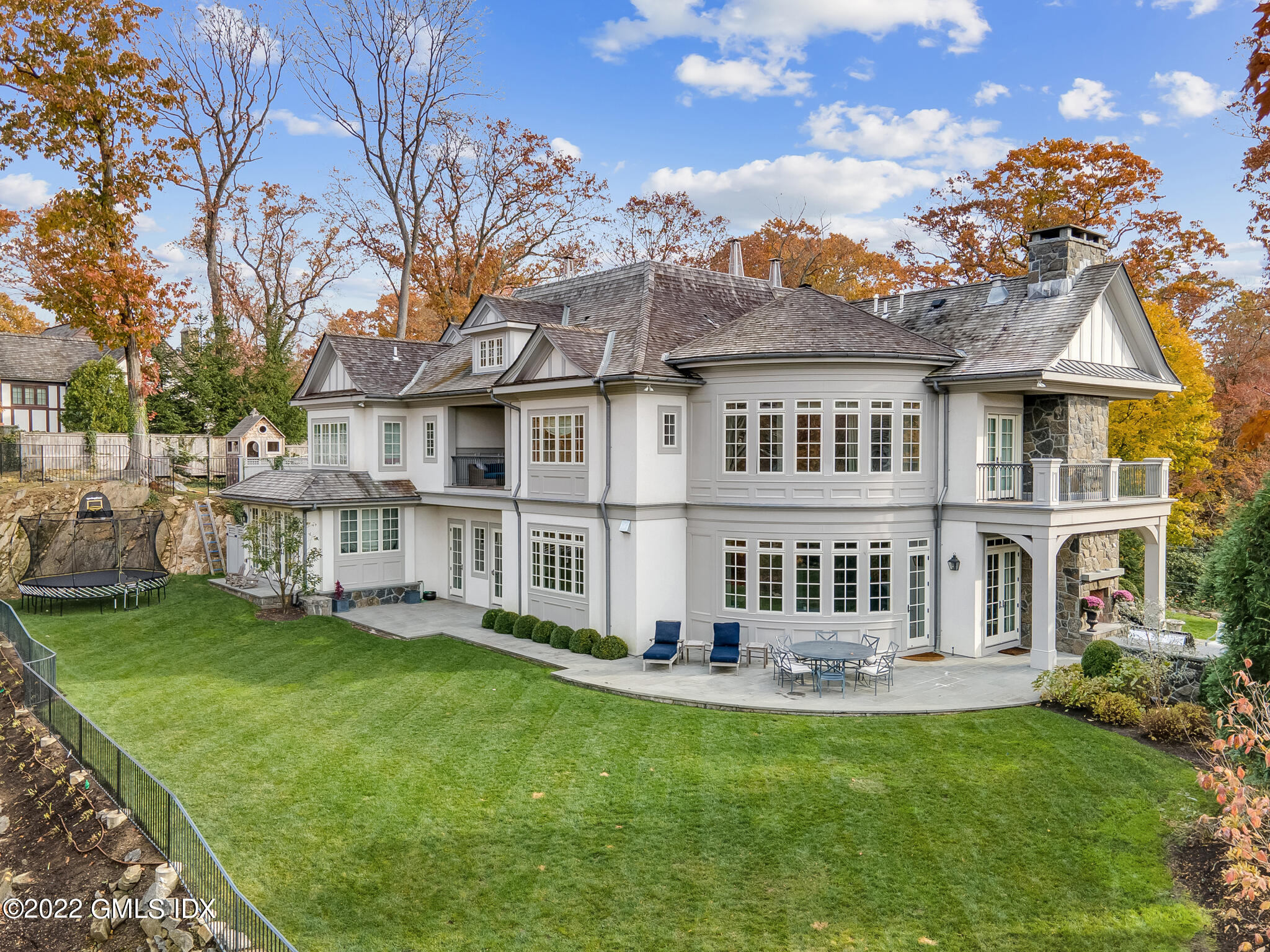 21 Woodside Drive Greenwich, CT 06830 - Photo 27 of 35 a front view of a house with a garden and lake view