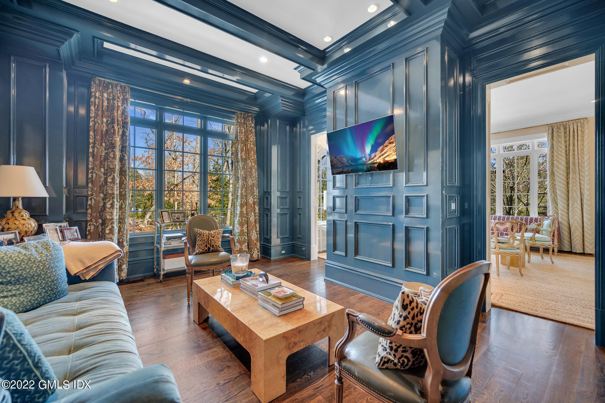 21 Woodside Drive Greenwich, CT 06830 - Photo 4 of 35 a living room with furniture a flat screen tv and floor to ceiling window