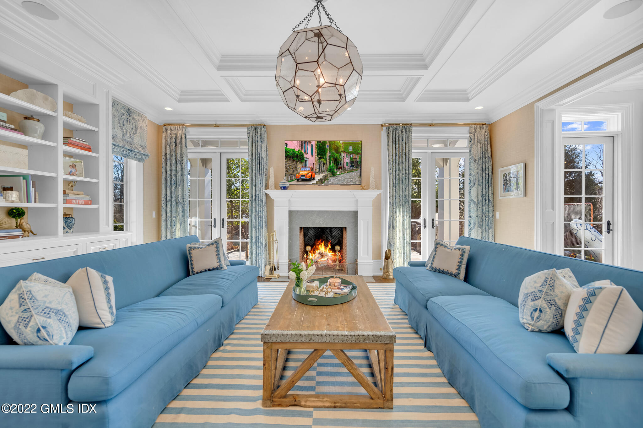 21 Woodside Drive Greenwich, CT 06830 - Photo 6 of 35 a living room with furniture a chandelier and a fireplace