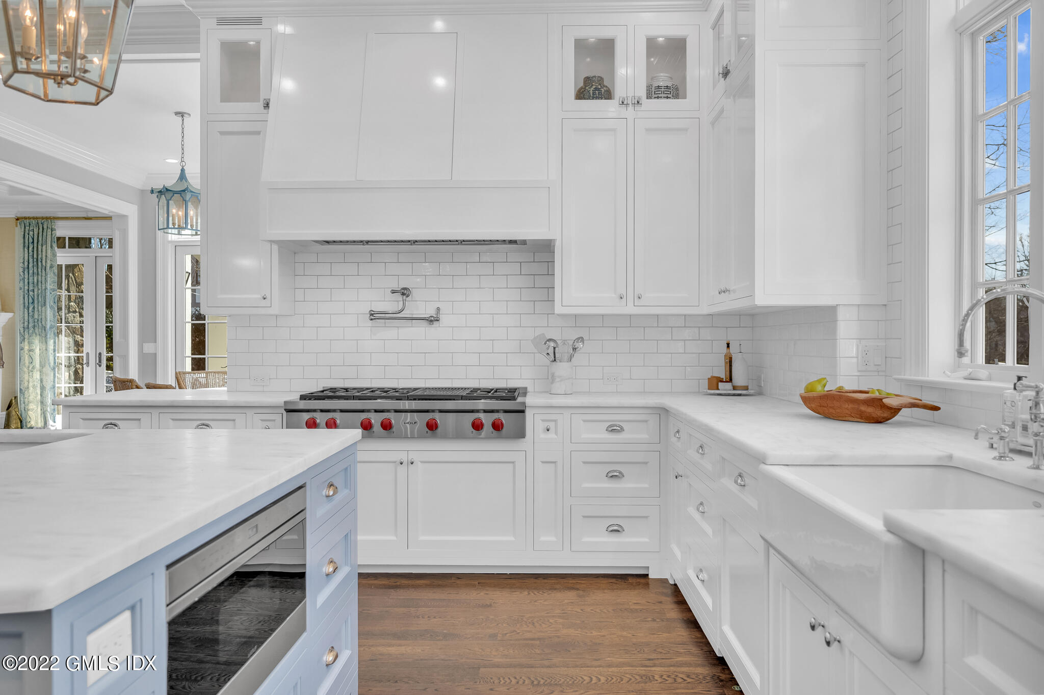 21 Woodside Drive Greenwich, CT 06830 - Photo 9 of 35 a kitchen with stainless steel appliances a stove a sink and a white cabinets