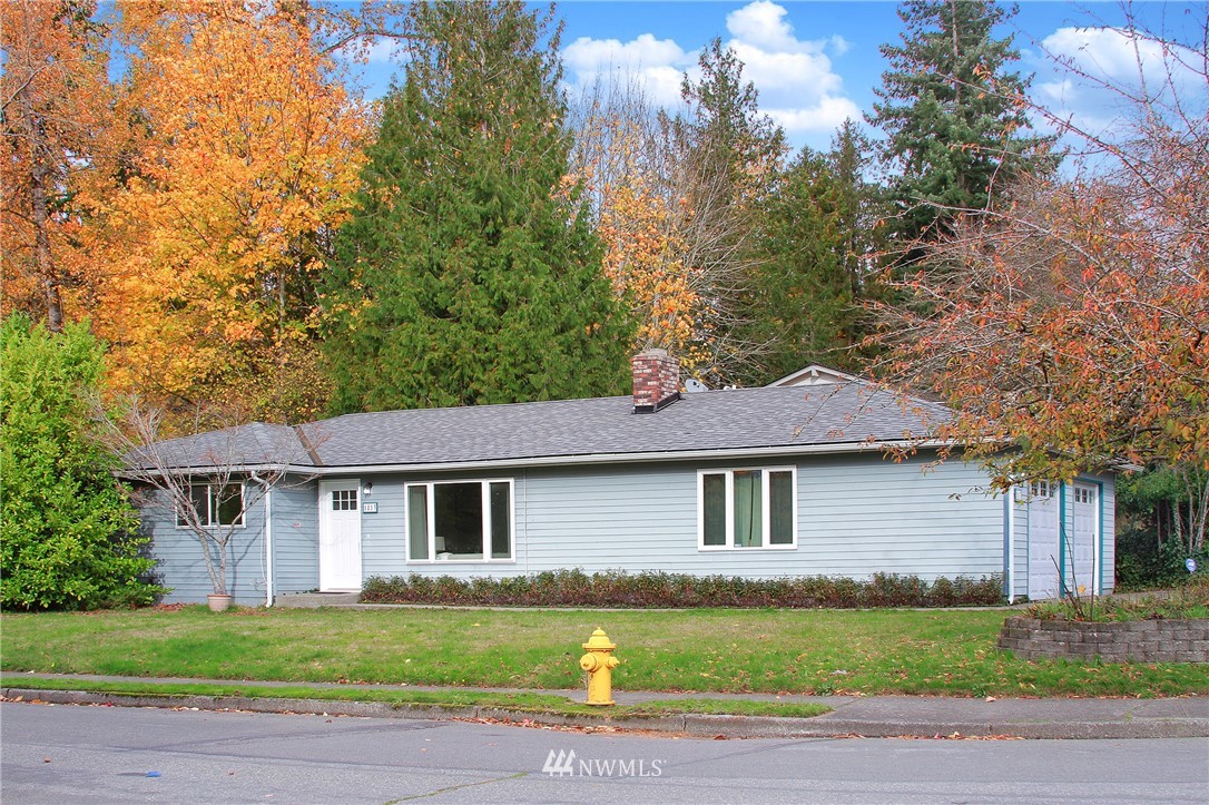 1813 Aberdeen Avenue Southeast Renton, WA 98055 - Photo 2 of 22 a front view of a house with a garden and yard