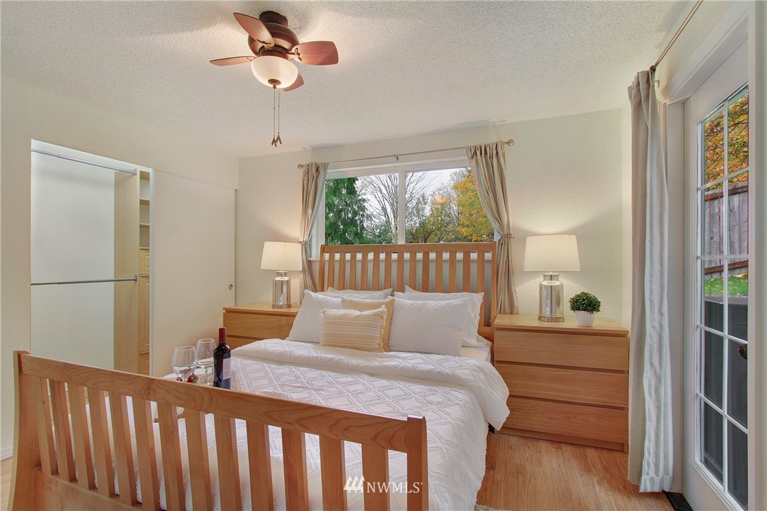 1813 Aberdeen Avenue Southeast Renton, WA 98055 - Photo 11 of 22 a bedroom with a bed and wooden floor
