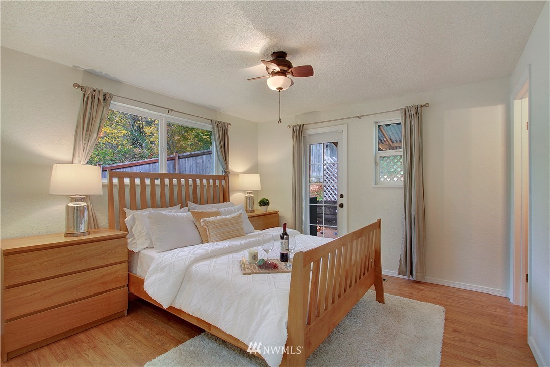 1813 Aberdeen Avenue Southeast Renton, WA 98055 - Photo 12 of 22 a bedroom with bed and wooden floor