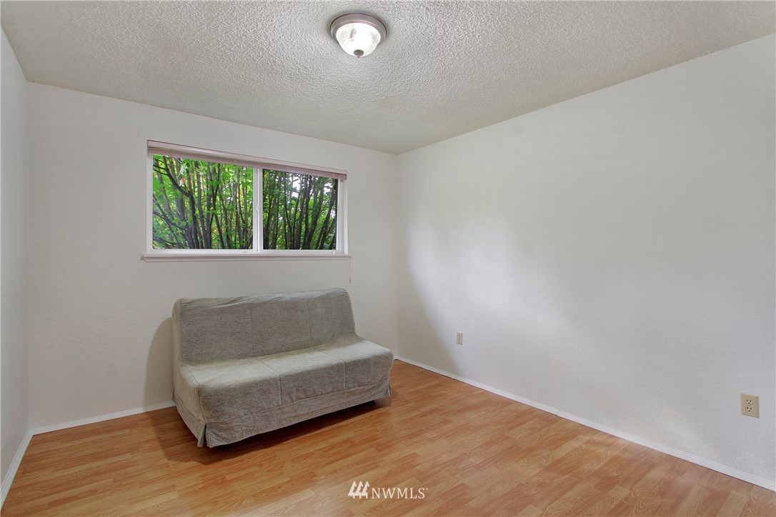 1813 Aberdeen Avenue Southeast Renton, WA 98055 - Photo 14 of 22 a living room with a couch and a window