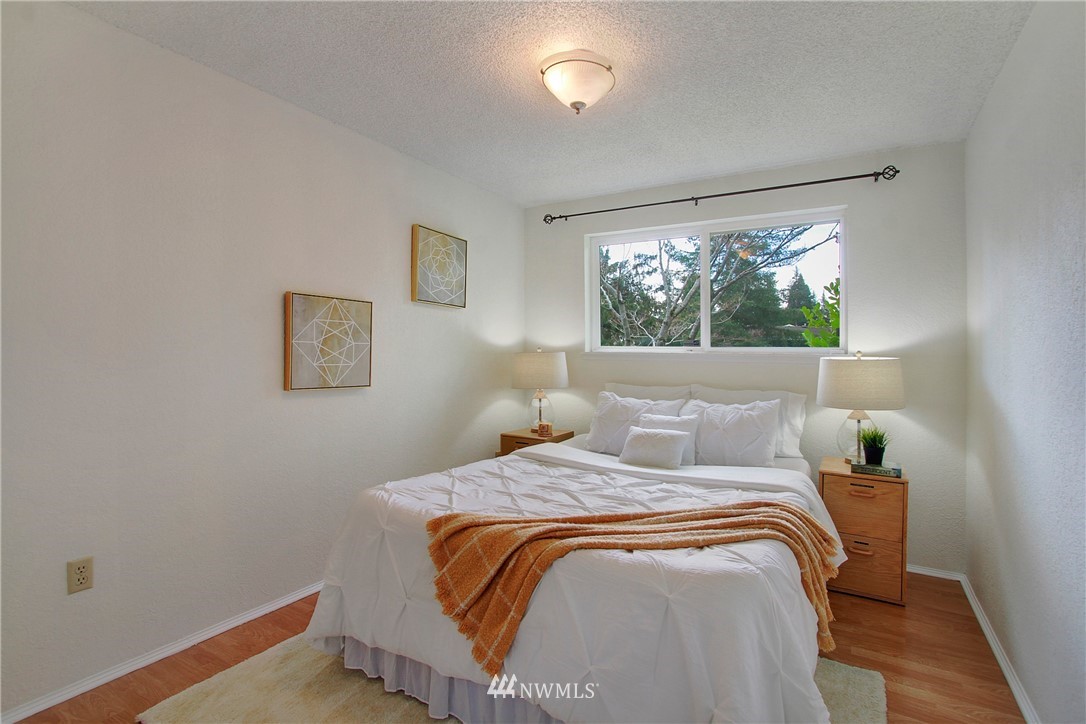 1813 Aberdeen Avenue Southeast Renton, WA 98055 - Photo 15 of 22 a bed sitting in a bedroom next to a window