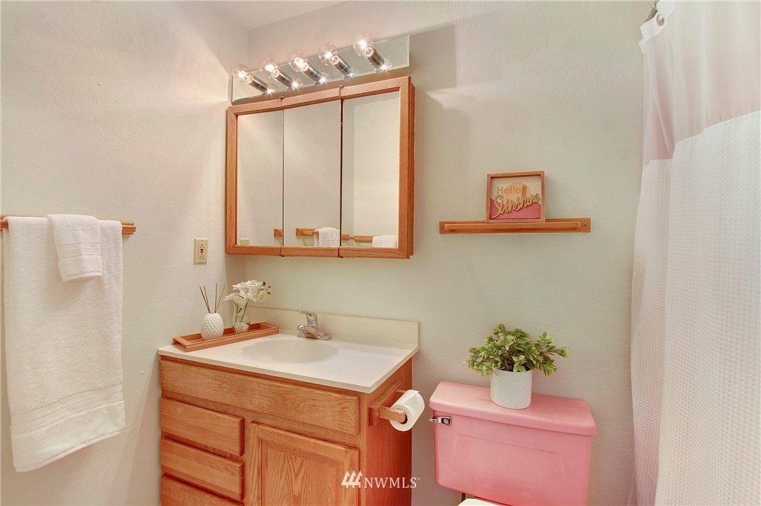 1813 Aberdeen Avenue Southeast Renton, WA 98055 - Photo 16 of 22 a bathroom with a sink mirror and vanity