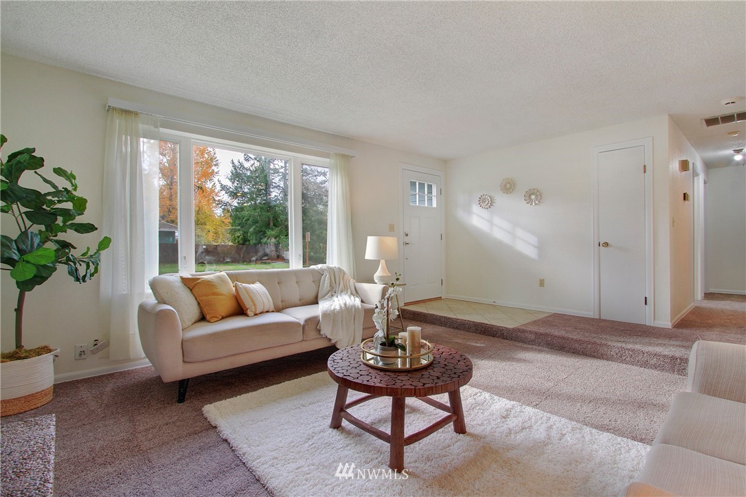 1813 Aberdeen Avenue Southeast Renton, WA 98055 - Photo 5 of 22 a living room with furniture and a large window
